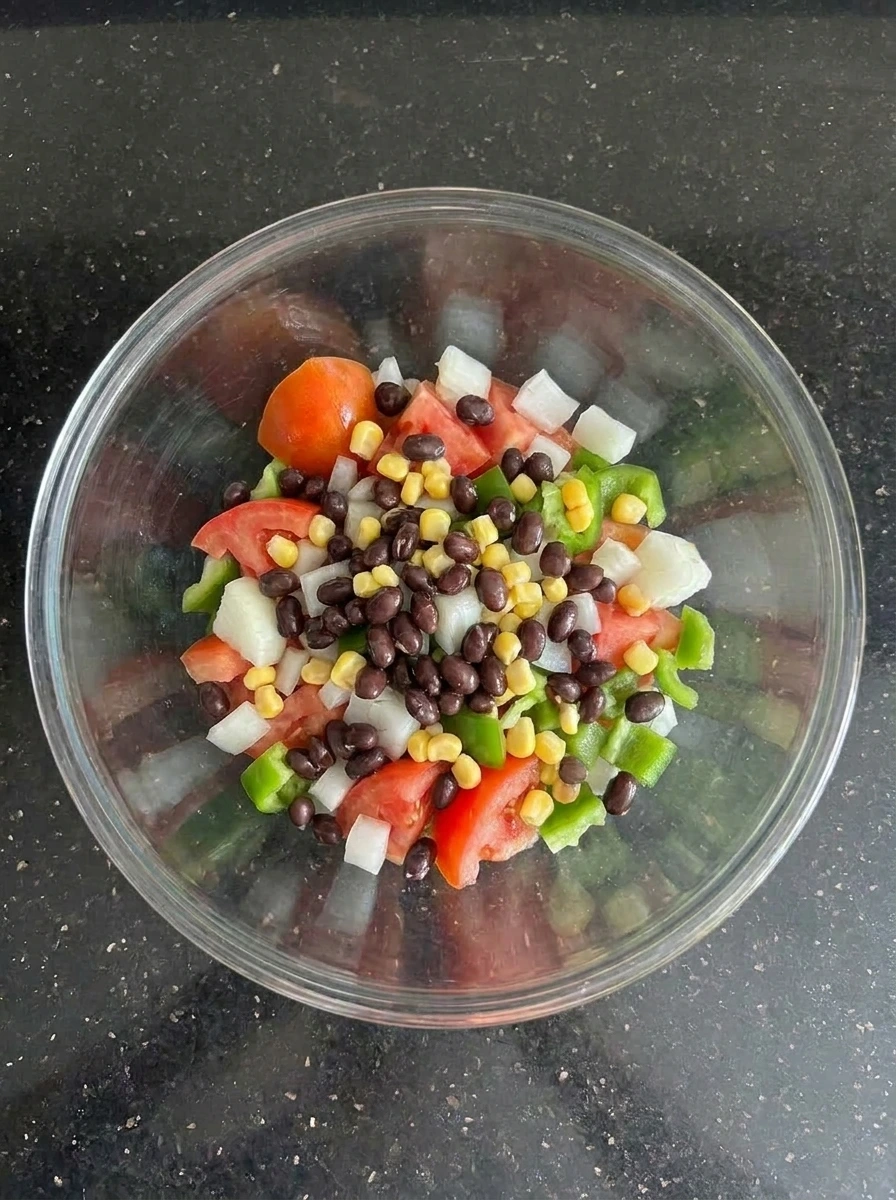 beans and corn added to vegetables