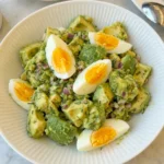 creamy avocado egg salad in bowl