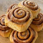 Cookies and Cream Cinnamon Rolls plated with glaze