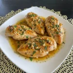 Crockpot Garlic Butter Chicken plated with rich sauce