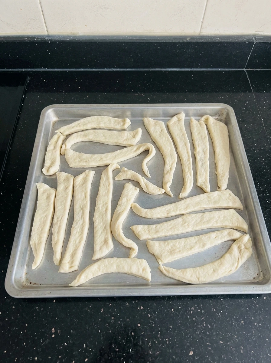 Dough cut into uneven strips