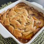 Easy Peach Cobbler golden topping and juicy peaches