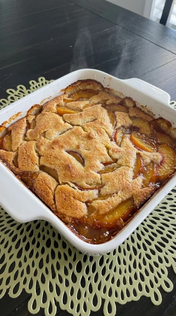 Easy Peach Cobbler golden topping and juicy peaches