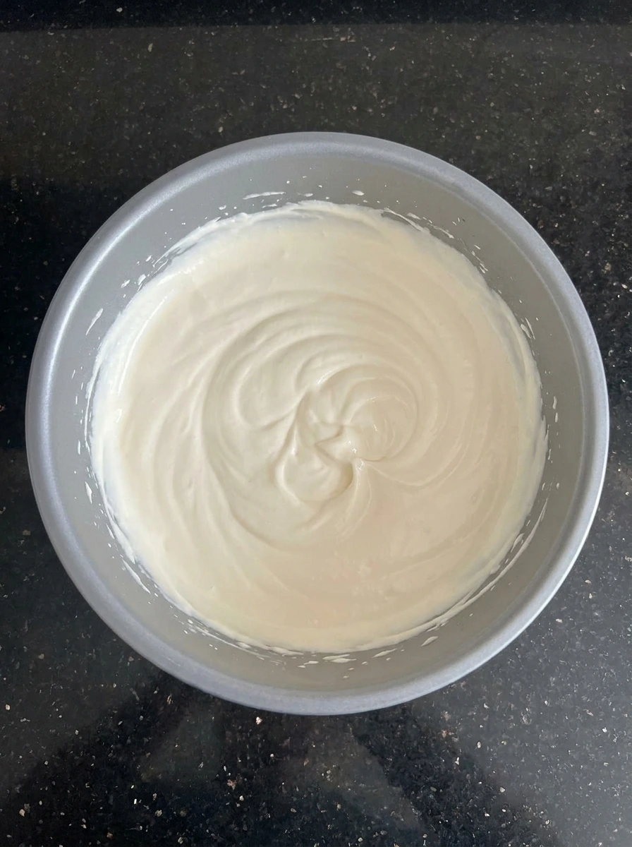 strawberries folded into creamy mixture