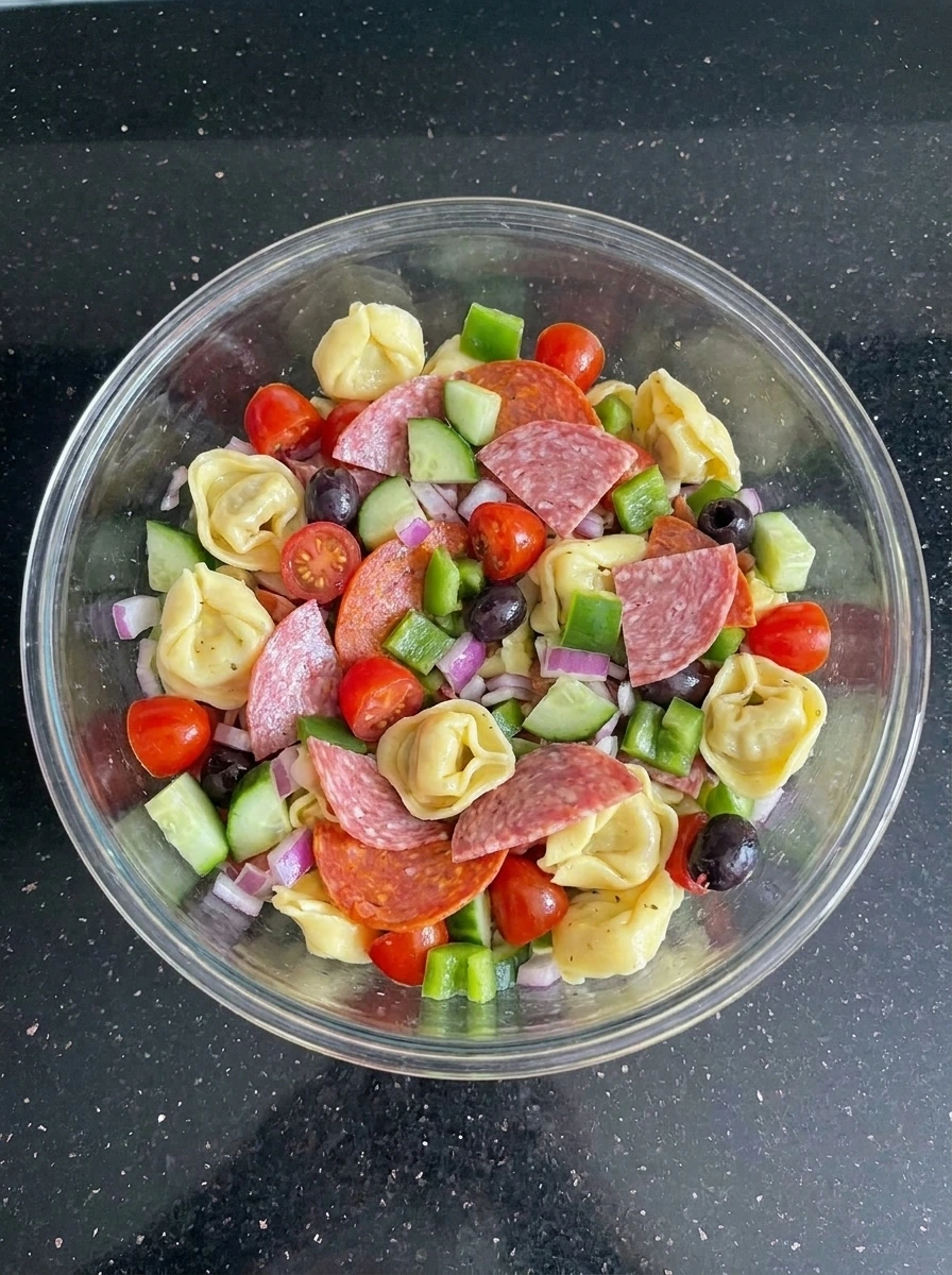 Tortellini mixed with meats and vegetables