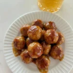 Honey BBQ Crockpot Meatballs coated in sticky sauce