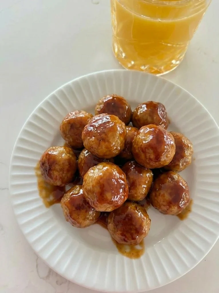 Honey BBQ Crockpot Meatballs coated in sticky sauce