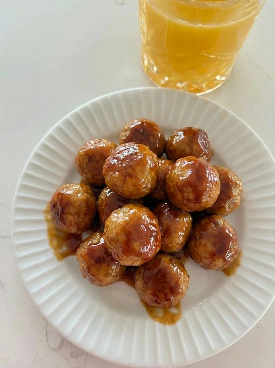 Honey BBQ Crockpot Meatballs coated in sticky sauce