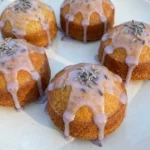 mini lemon cakes with lavender glaze on plate