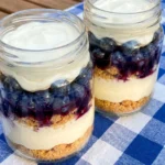 no bake red white and blue cheesecake jars with layered berries