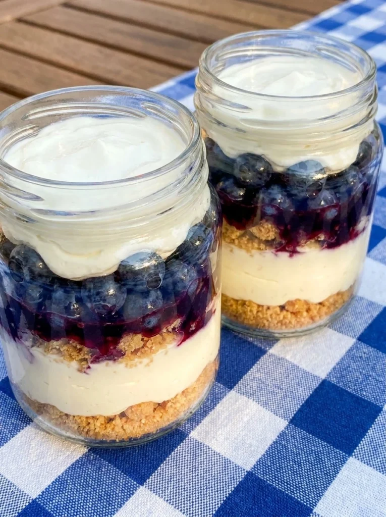 no bake red white and blue cheesecake jars with layered berries