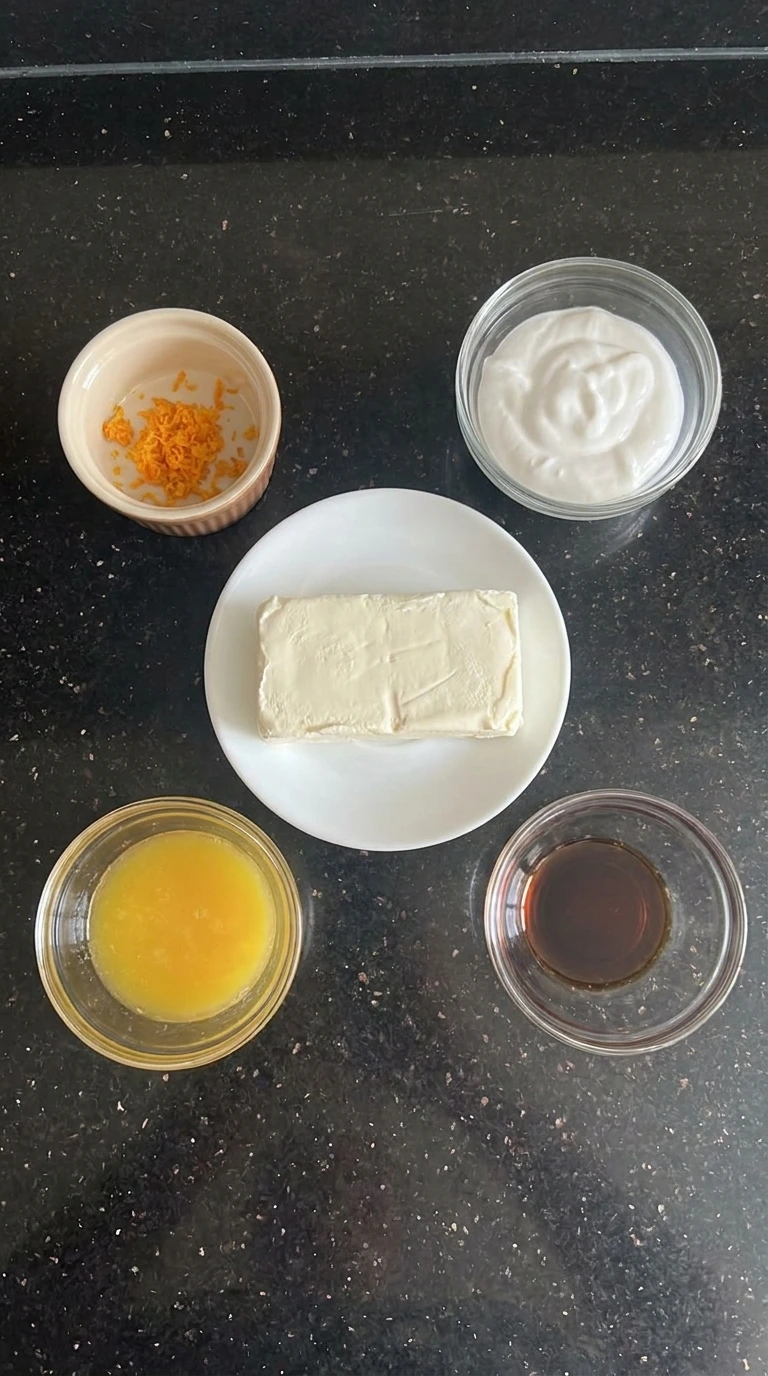 ingredients for orange fruit dip in separate bowls