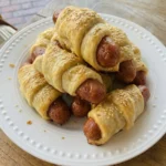 Golden pigs in a blanket with flaky dough and juicy sausages