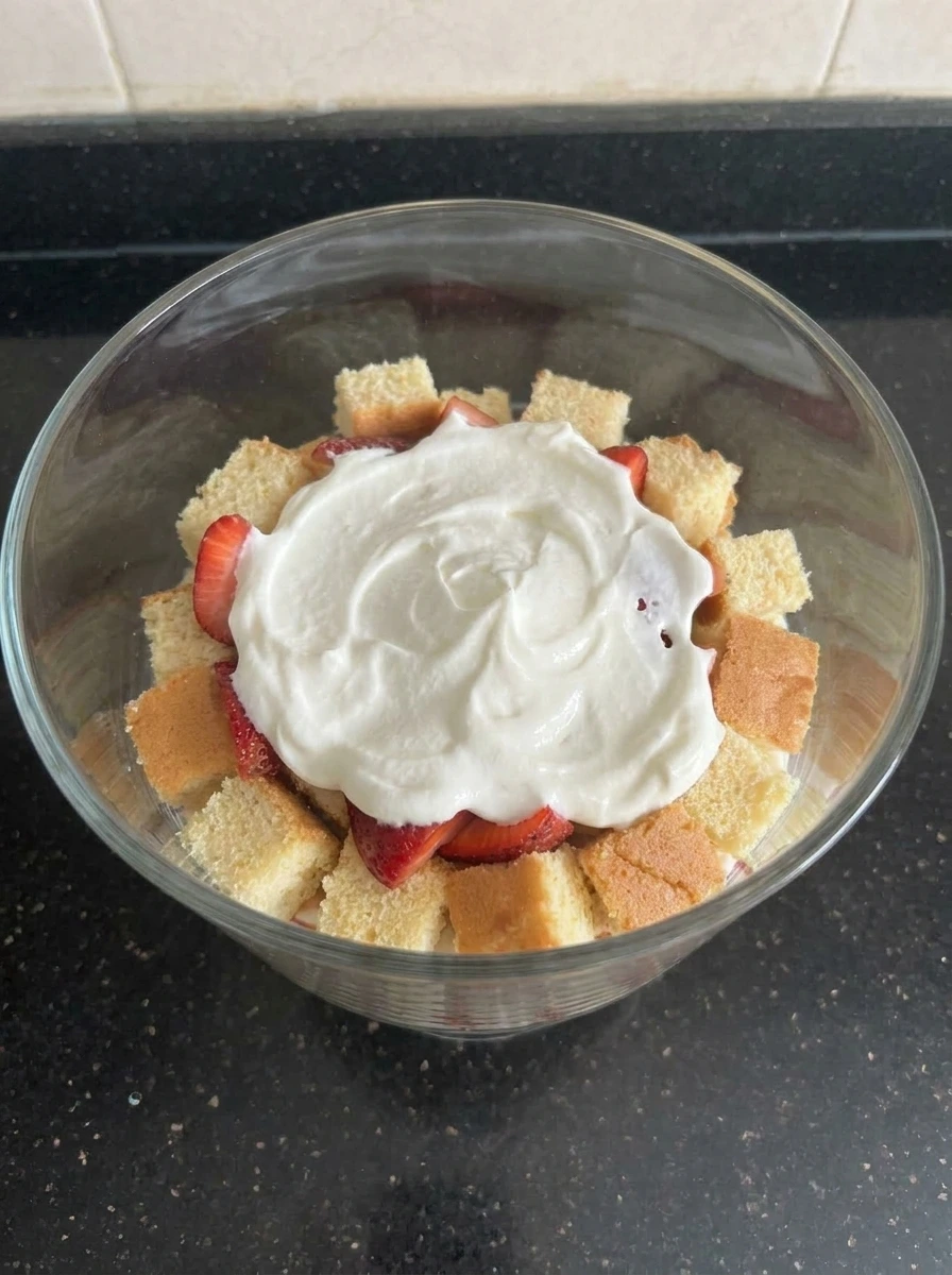 Cream layer over strawberries
