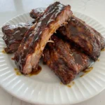 Slow Cooker Ribs tender and saucy on plate