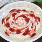 creamy strawberry cheesecake dip with visible strawberry pieces