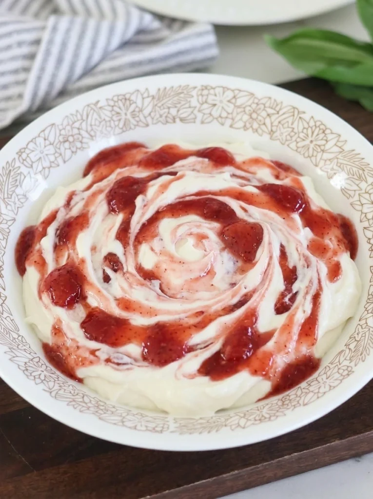 creamy strawberry cheesecake dip with visible strawberry pieces