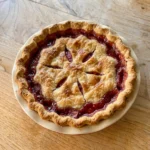 homemade strawberry rhubarb pie with golden crust