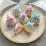 Colorful Cotton Candy Cheesecake Bombs with creamy filling and candy coating