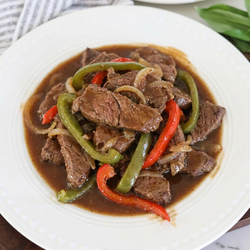 Served Crockpot Pepper Steak over rice