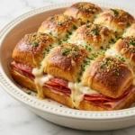 Hot Italian Sub Sliders baked with melted cheese and Italian meats