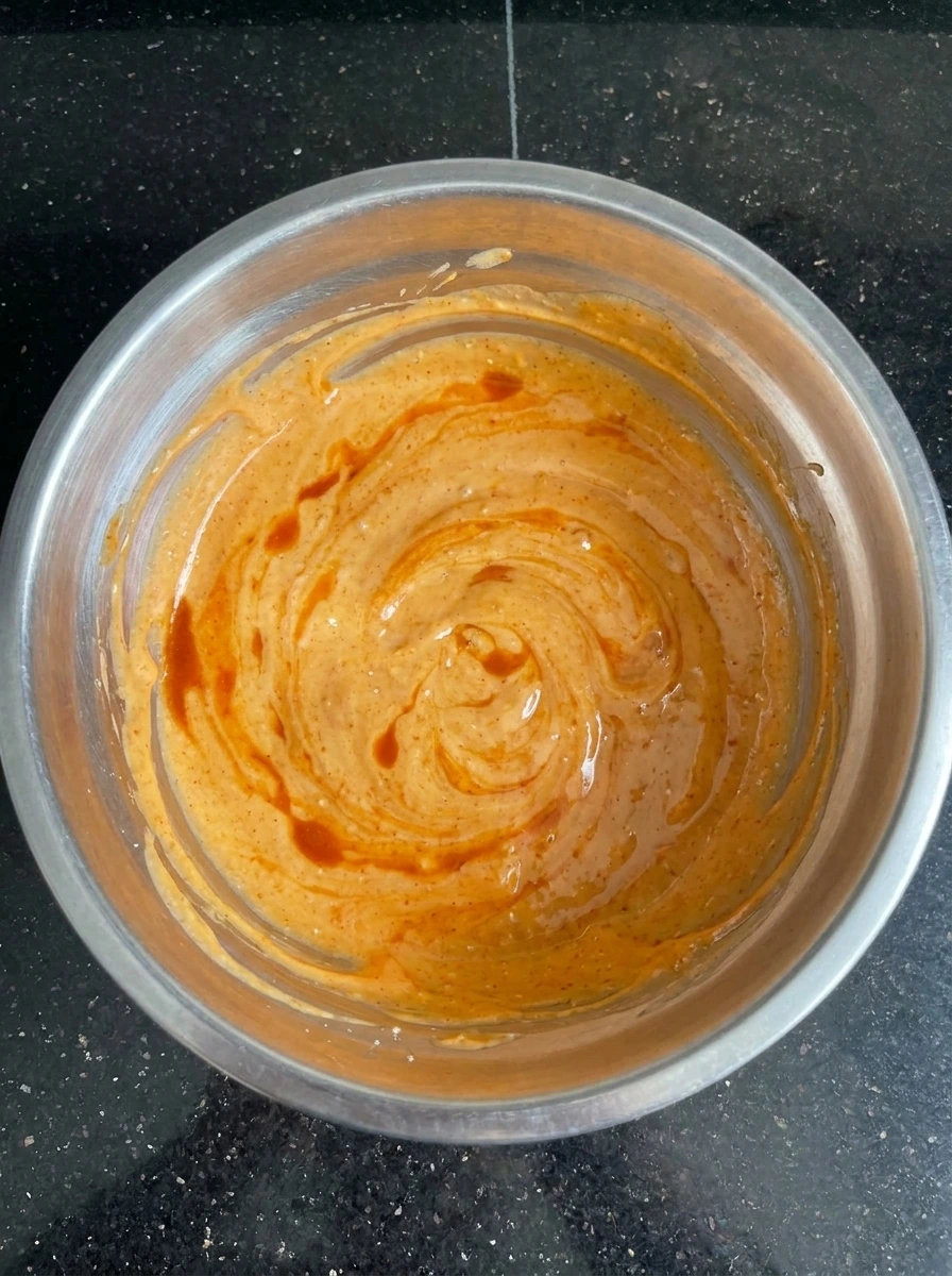 Creamy spicy voodoo sauce in bowl