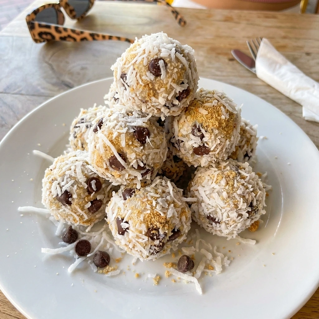 Moose Farts Dessert bites coated with coconut on a white plate