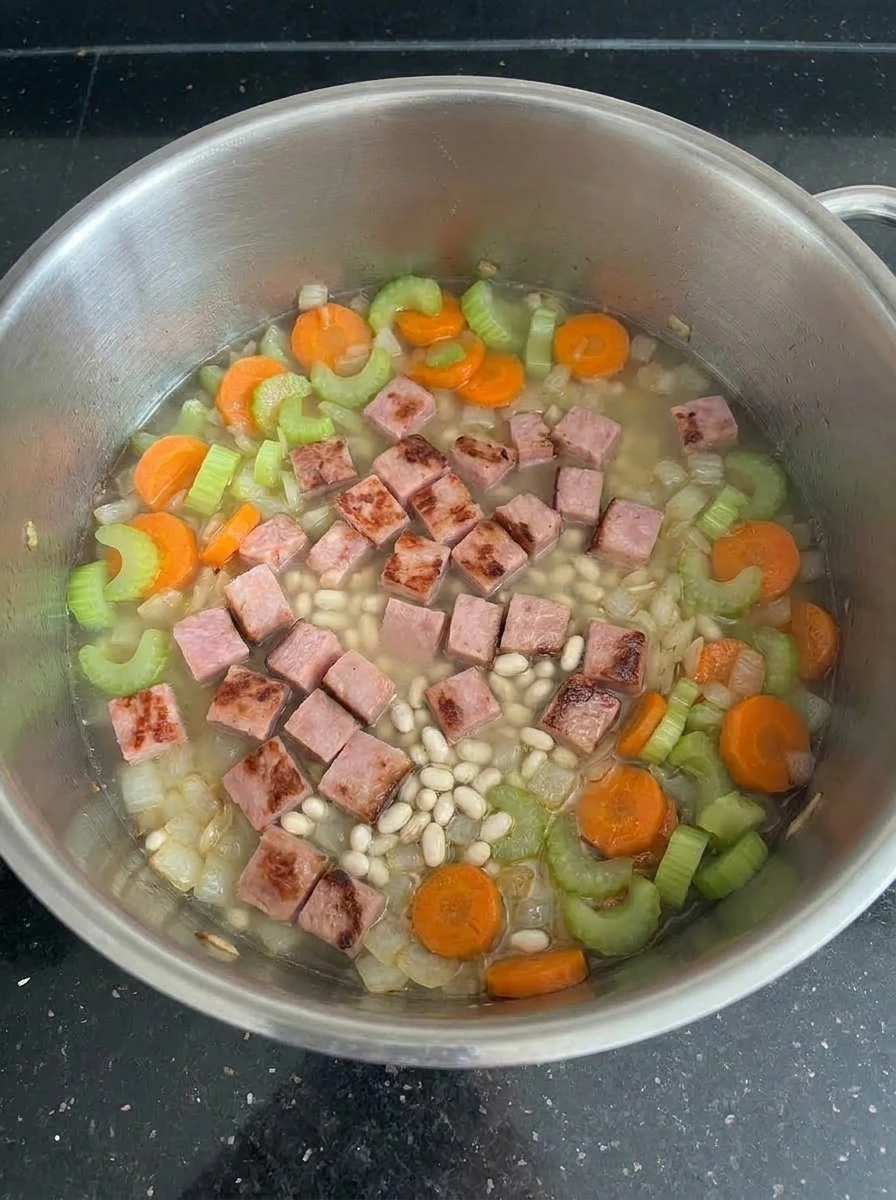 Beans and broth added to soup pot.