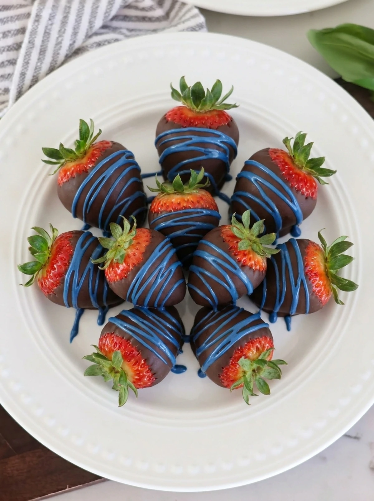 blue drizzle on strawberries