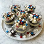Red White and Blue Dirt Cups layered with pudding and cookie crumbs