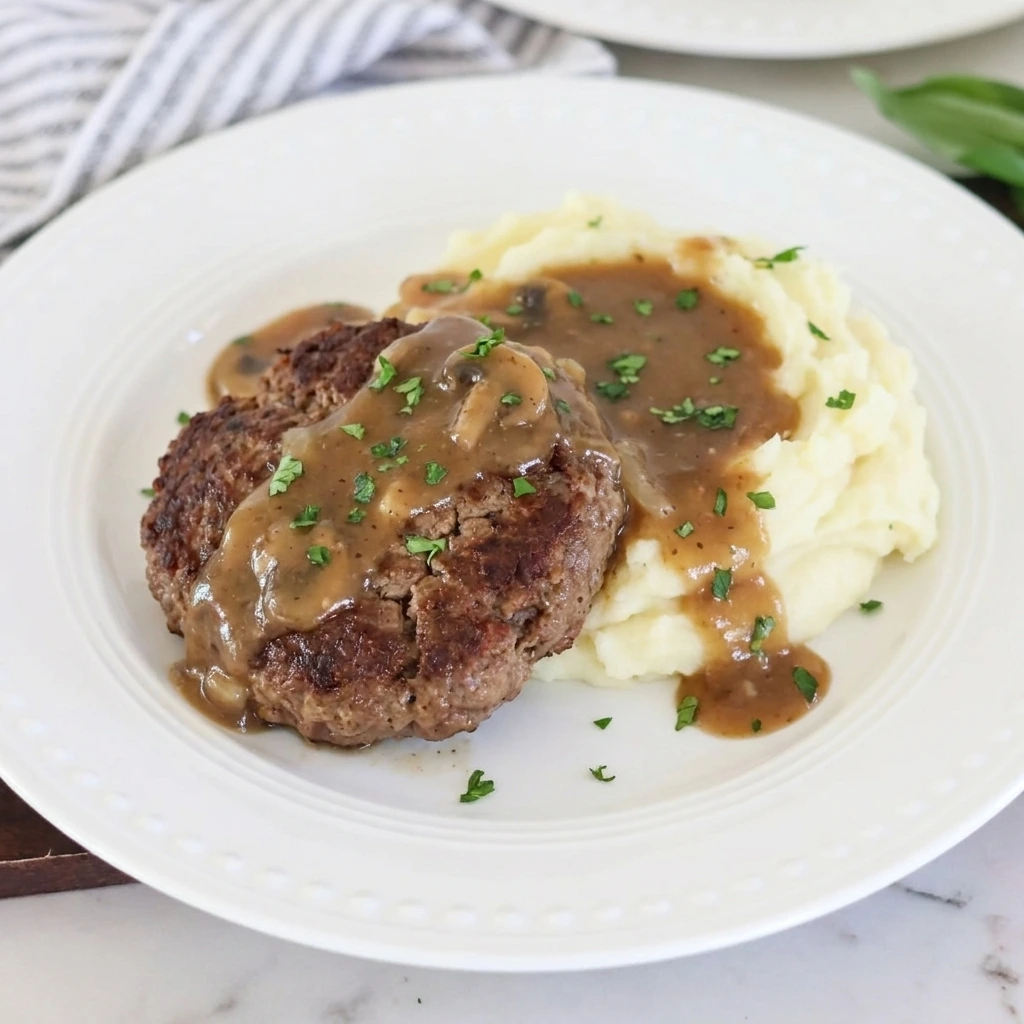Plated Slow Cooker Salisbury Steak with mashed potatoes