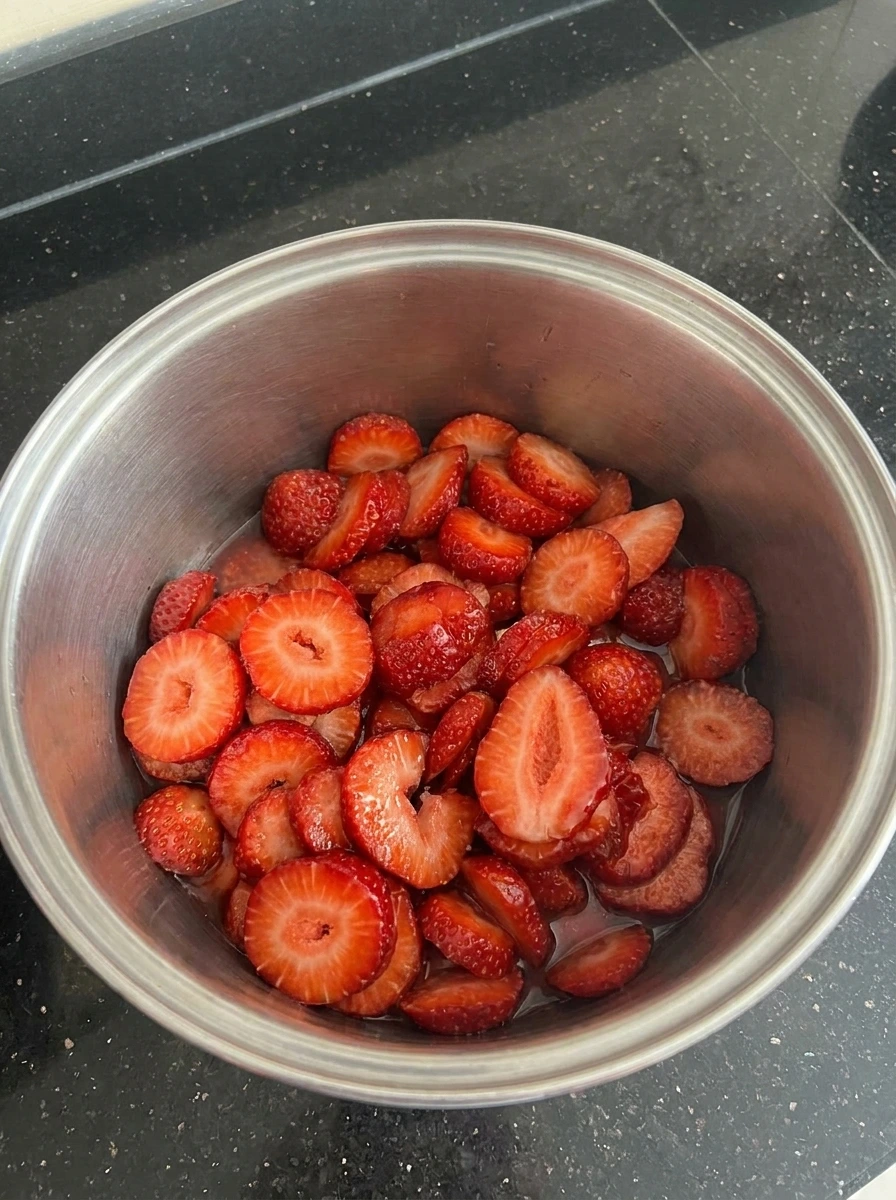 Fresh sliced strawberries inside pot