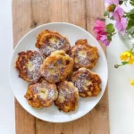 Golden homemade Banana Fritters on a plate