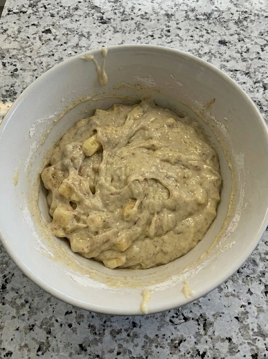 Mashed banana folded into Banana Fritters batter