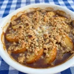 Buttery Peach Crisp with golden oat topping and soft baked peaches