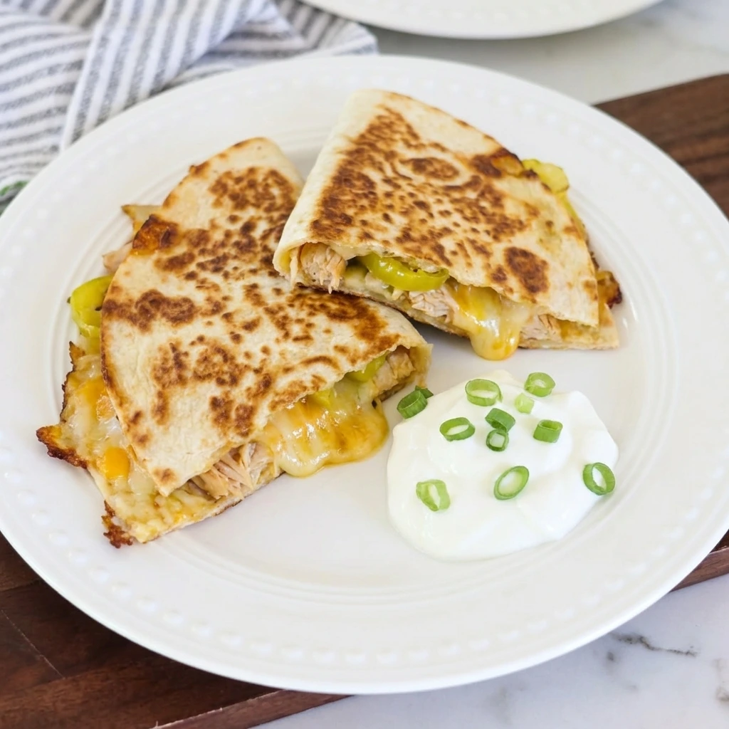 Crispy Banana Pepper Quesadillas with melted cheese and browned tortillas