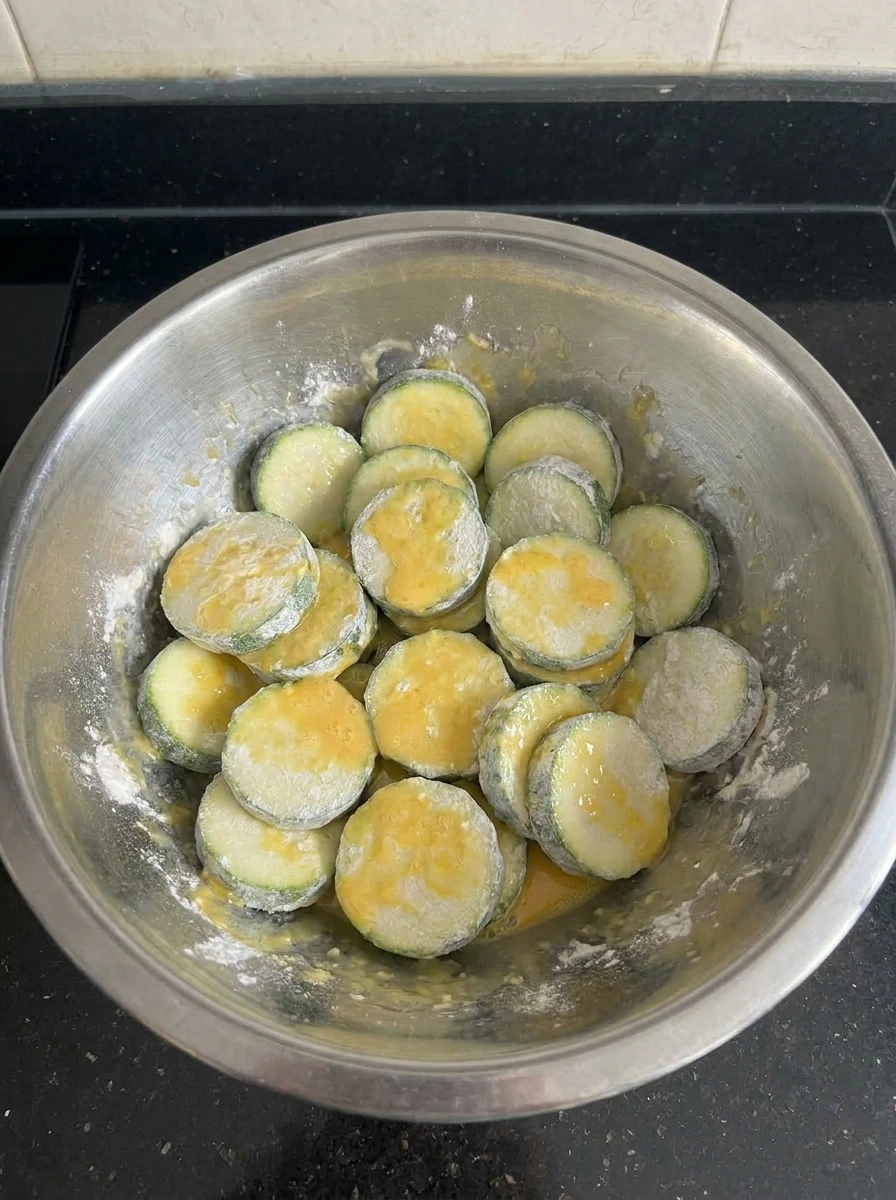 Floured zucchini dipped in egg