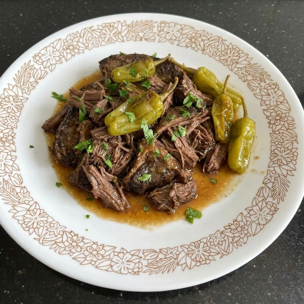Single serving of Crockpot Mississippi Pot Roast on a white plate