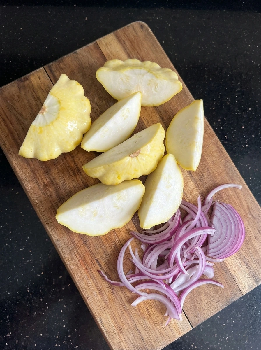 Sliced patty pan squash and red onion for Grilled Patty Pan Squash Salad.