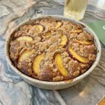 Nectarine Coffee Cake with golden crumb topping and juicy fruit slices