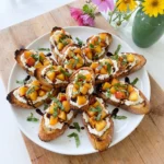 Peach Bruschetta with ricotta and basil on toasted baguette slices