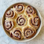 Homemade Raspberry Sweet Rolls with raspberry filling and vanilla glaze