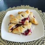 Raspberry Turnovers with flaky golden pastry and raspberry filling