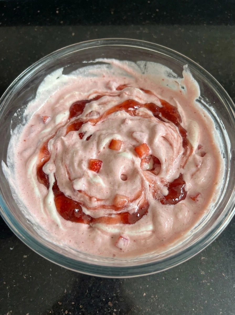 Creamy strawberry filling folded for Strawberry Shortcake Ice Cream Bars