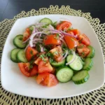 Fresh Tomato Cucumber Salad with cucumbers onions and parsley
