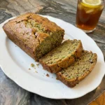 Homemade Zucchini Bread loaf with sliced tender crumb