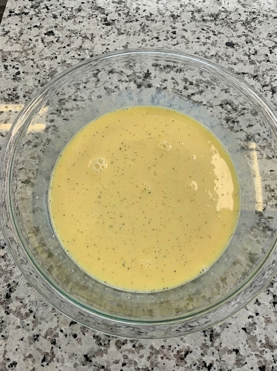 Egg mixture whisked for Zucchini Breakfast Casserole
