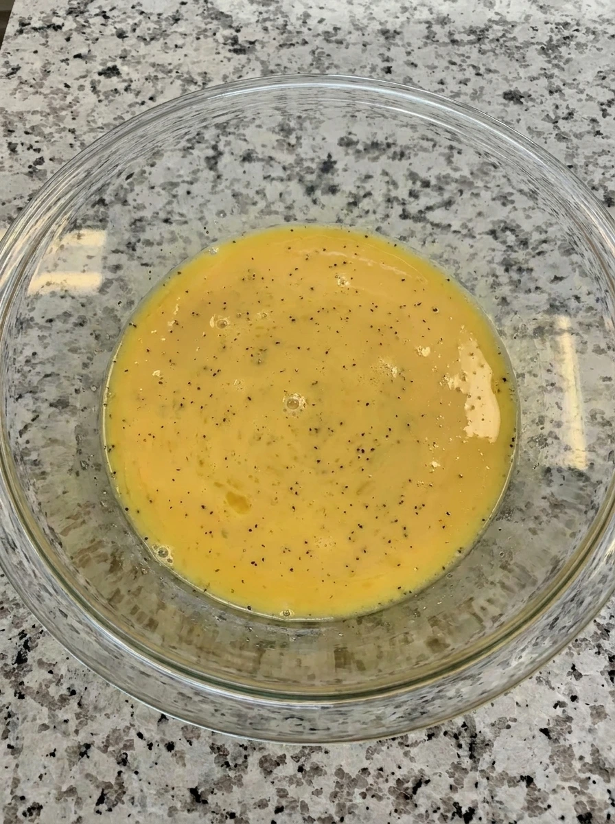 Whisked eggs and milk for Zucchini Egg Bites.