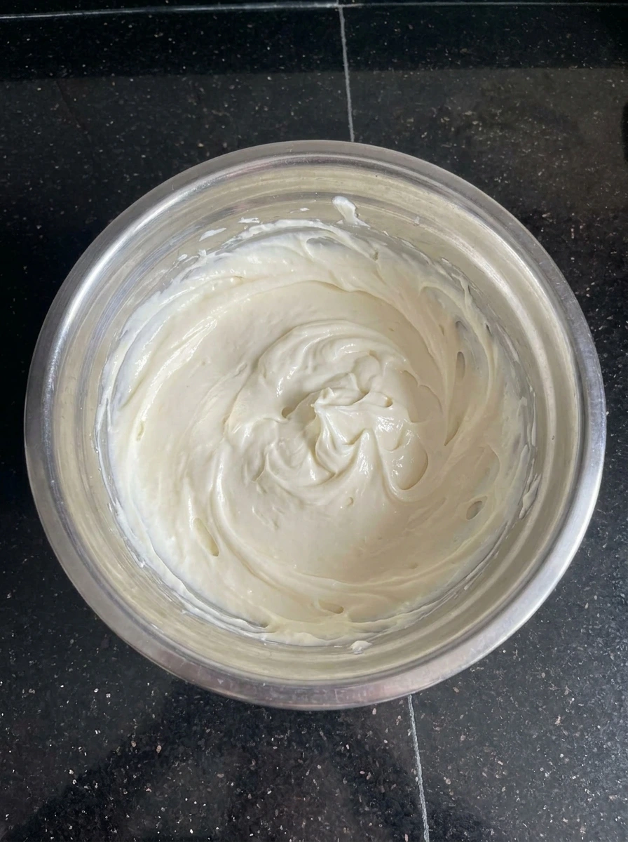 Creamy cheesecake filling mixed for Apple Crisp Cheesecake Cups