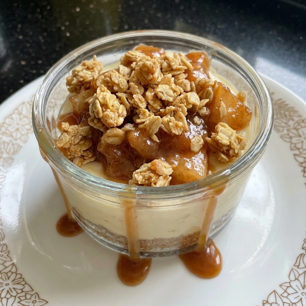 Single serving of Apple Crisp Cheesecake Cups on a plate